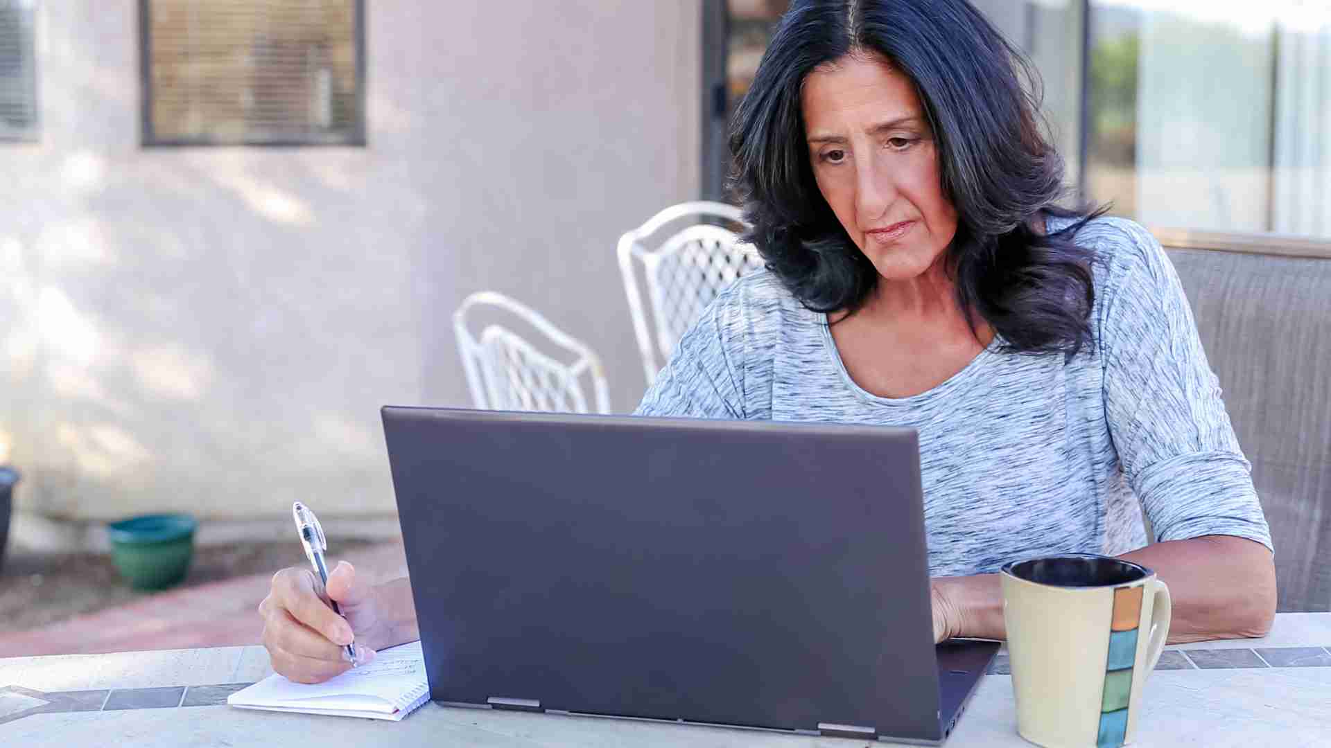 A woman looking at her computer trying to decide: should I use a DIY trust